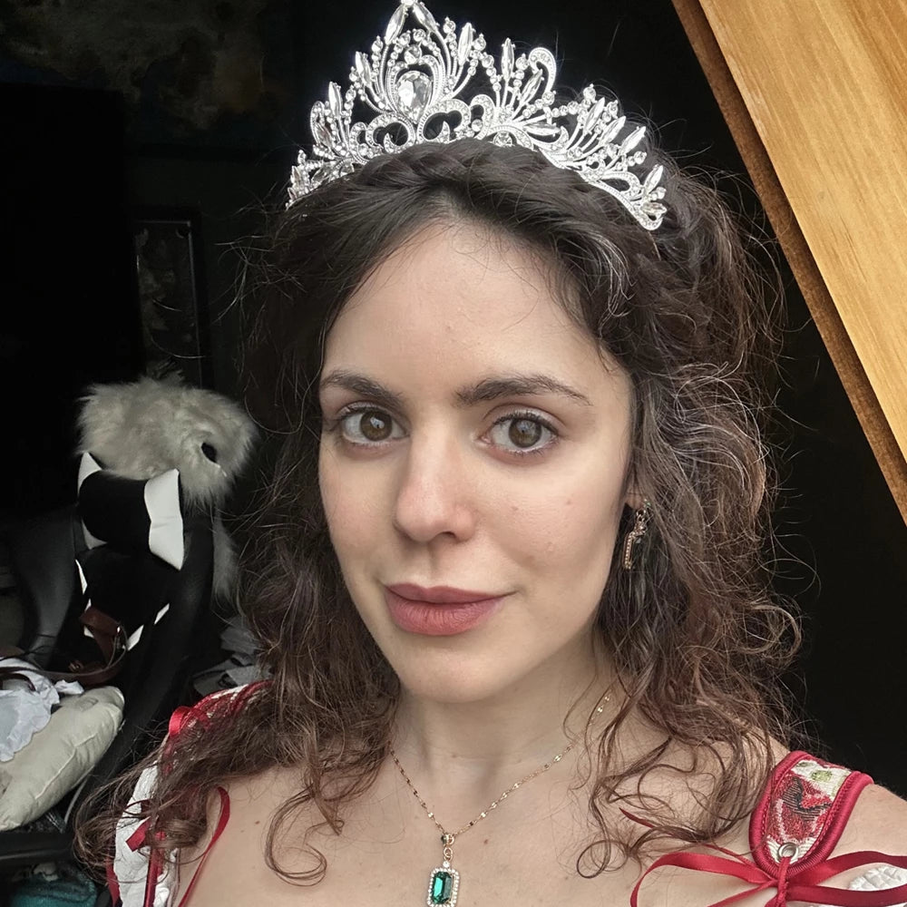 A fun silver (or gold) sparkly rhinestone tiara. <3